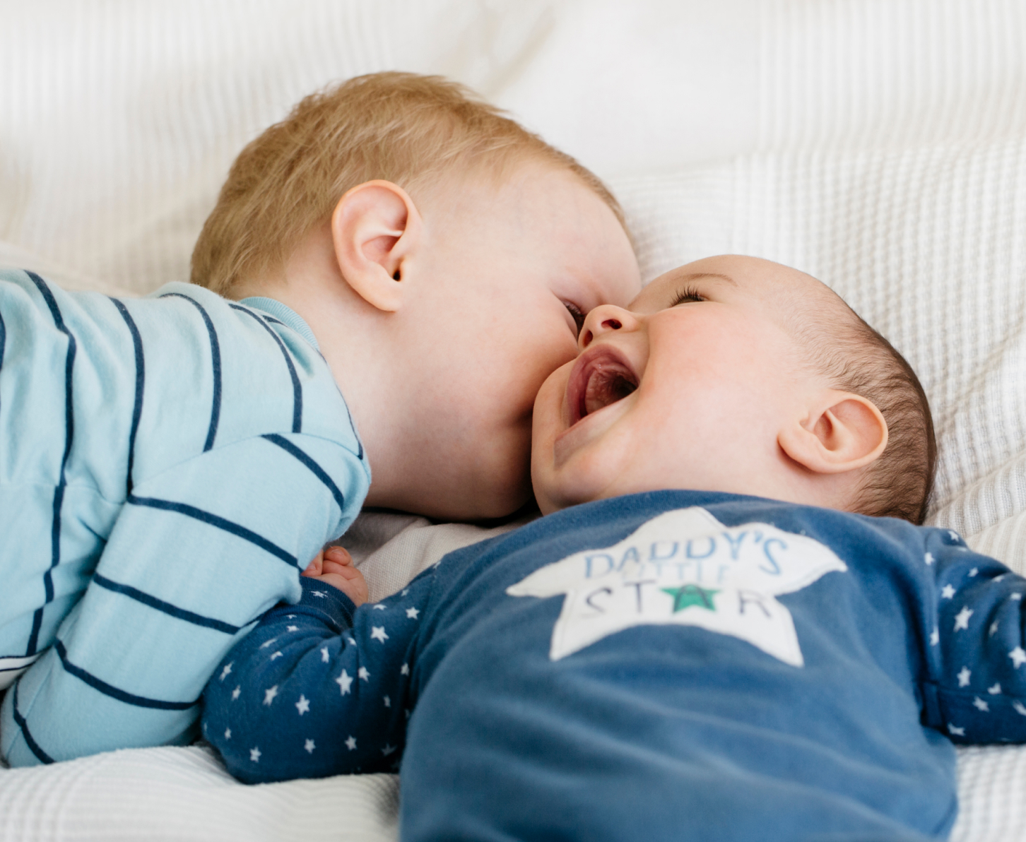 Babies laughing together.